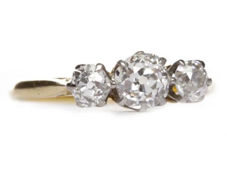 EARLY TWENTIETH CENTURY DIAMOND THREE STONE RINGset with three graduated old round brilliant cut diamonds totalling approxima