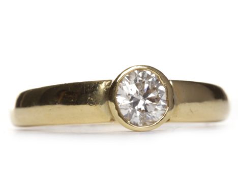 DIAMOND SOLITAIRE RINGthe collet set round brilliant cut diamond of approximately 0.46 carats in eighteen carat gold, size K-