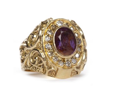 GENTLEMAN'S GEM AND DIAMOND RINGthe central oval purple gem surrounded by round diamonds, on moulded shoulders, in eighteen c