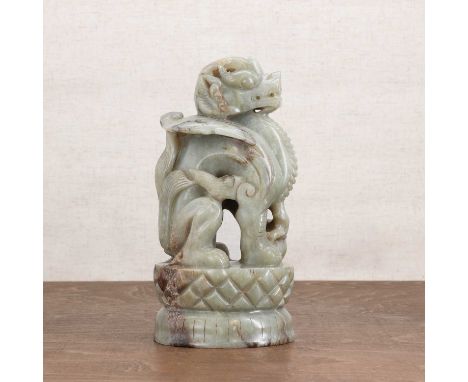 A Chinese jade carving,20th century, of a mythical beast statue,21cm highCondition ReportThe stone with cracks and small chip