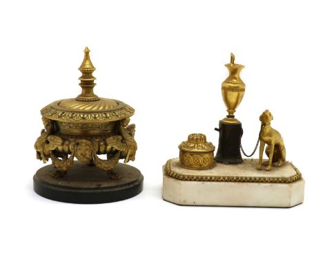 A French empire style ormolu encrier19th Century, in the form of a hound seated beside an ewer and a well, on a marble base14