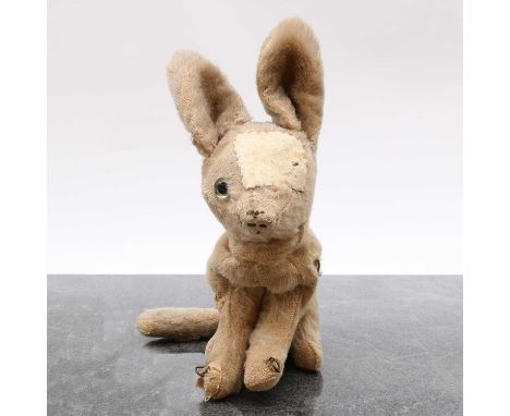 A Farnell Alpha toy rabbit,c.1930s, with a fabric label,22cm highCondition ReportLost an eye, which has a large repair patch.