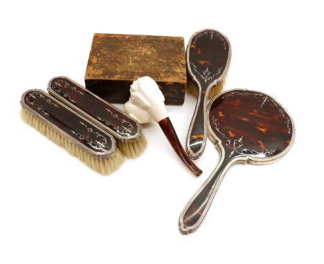 A silver mounted and tortoiseshell dressing table set,by Adie Brothers Ltd, Birmingham 1928, 1930 &amp; 1932, each with silve