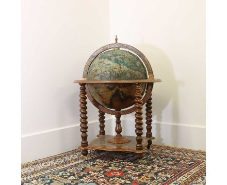 A terrestrial globe drinks cabinet20th century,73cm diameter101cm highCondition ReportLifting and losses to the paper. Knocks