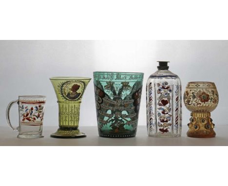 A group of enamelled glass items,comprising a Bohemian Historismus beaker, 19th century, enamelled with a two-headed eagle an