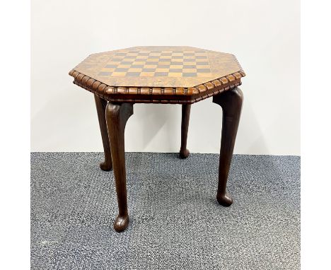 A 1920's hexagonal walnut veneered chess table, 53 x 53 x 51cm.