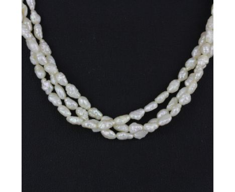 A triple row freshwater pearl necklace with an 18ct yellow gold (tested) clasp, L. 42cm.