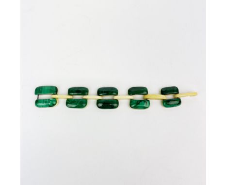 An interesting vintage malachite and bone bracelet, bracelet W. 2.8, L. 19cm.