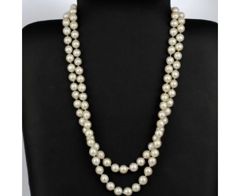 A double strand cultured pearl necklace with a 14ct yellow gold clasp set with round cabochon amethyst and seed pearls, L. 50