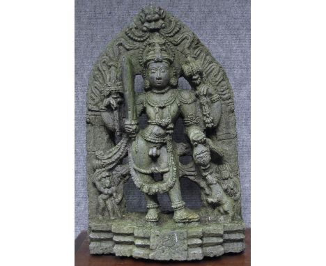 A HOYSALA STELE DEPICTING KHANDOBA Karnataka, Deccan, Southern India, circa 13th century grey schist, the four-armed deity ho