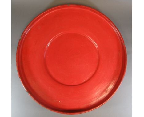 A RICE WINNOWING BOWL Burma, early 20th century Red lacquered woven bamboo, of wide circular form, with raised edge and reces