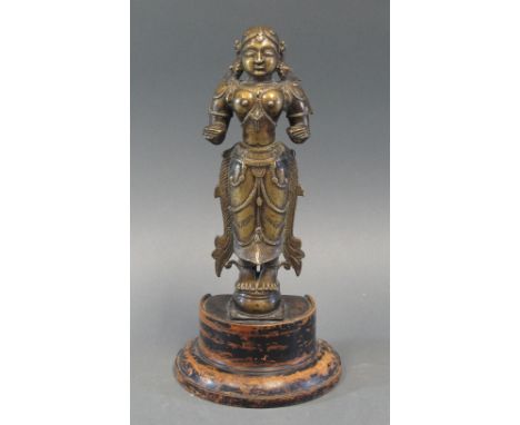 DIPA-LAKSHMI Tamil Nadu, South India, 19th century cast brass, the female deity standing with her hands held out, wearing lar