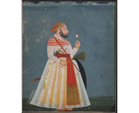 A PORTRAIT OF A MEWAR RULER, PROBABLY BHIM SINGH Udaipur, Rajasthan, circa 1720-30 gouache with gold on paper, two lines of d
