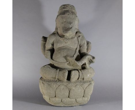 AN ANDESITE FIGURE OF GANESHA Java, Indonesia, 9th/10th century The plump elephant-headed four armed Hindu deity seated on a 