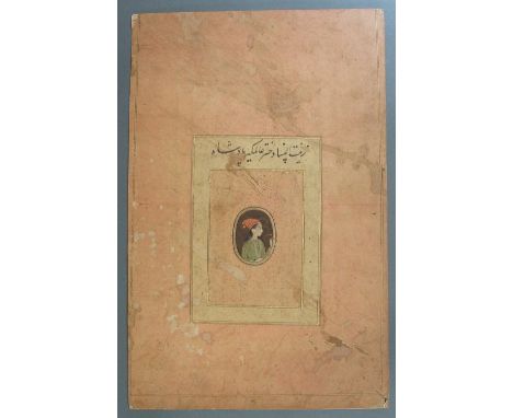 PORTRAIT OF A LADY Mughal India, circa 1700 gouache with gold on paper, of oval form, laid onto an album page, the woman wear