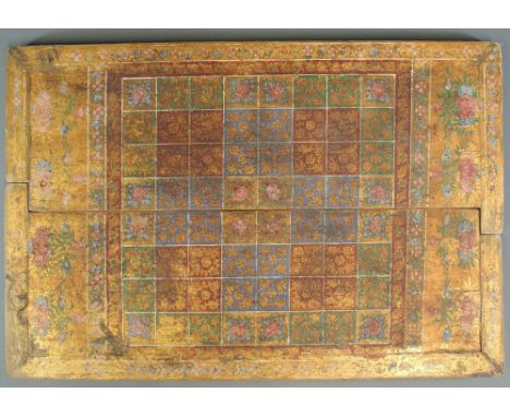 A TWO SIDED GAMING BOARD Possibly Kurnool, Southern India, 19th century polychrome-painted and gilt lacquered wood, dismantli