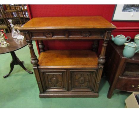 A 19th Century oak two tier buffet with reeded and carved bulbous supports, carved doors and drawers