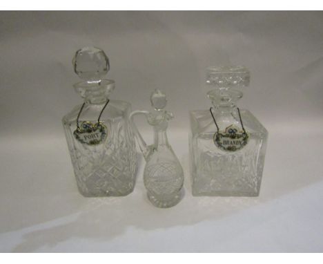 Two heavy glass decanters with ceramic spirit labels and another (3)