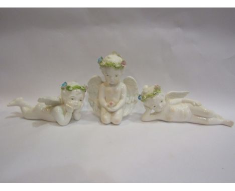 Three decorative ceramic cherubs, damage present 