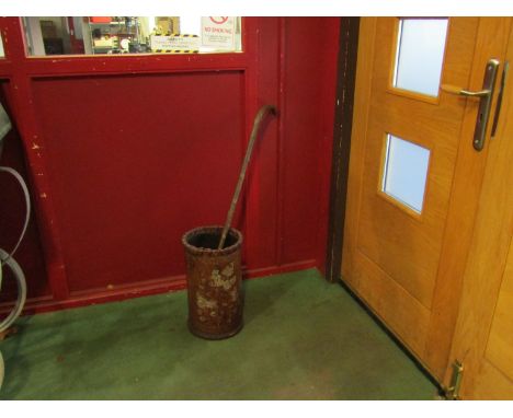 A worked leather stickstand with stick 