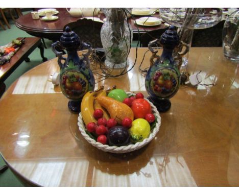 A pair of covered vases with fruit cartouches and a ceramic display of fruit (3)