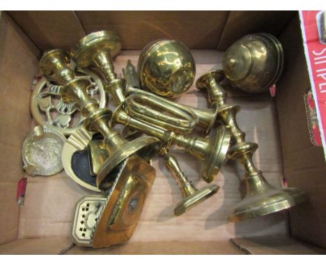 A selection of brass ornaments including candlesticks, tea caddies, Buddha and Bugle 