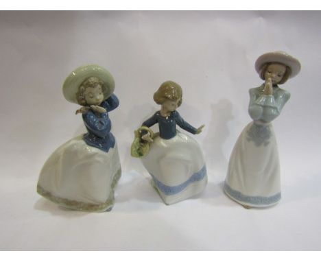 Three Nao porcelain figures including girl with bird on her shoulder 