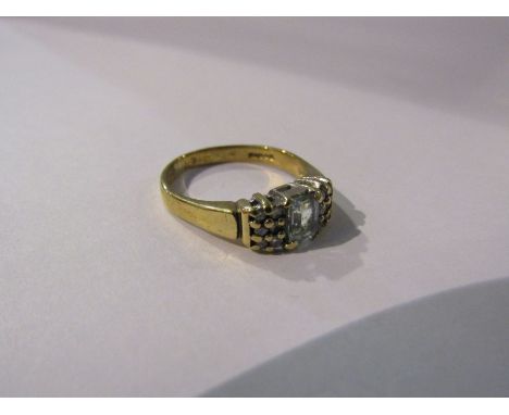 A 9ct gold ring with square aquamarine stone flanked by six small diamonds. Size N, 2.8g