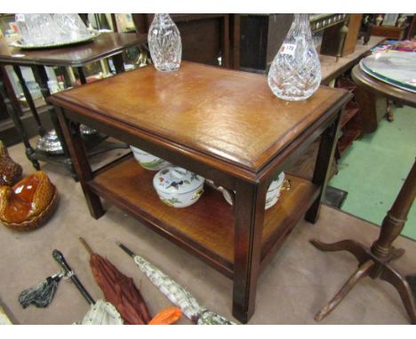 A Bevan and Funnel Georgian style mahogany two tier lamp table with gilt tooled leather shelves, 46cm x 69cm x 50cm