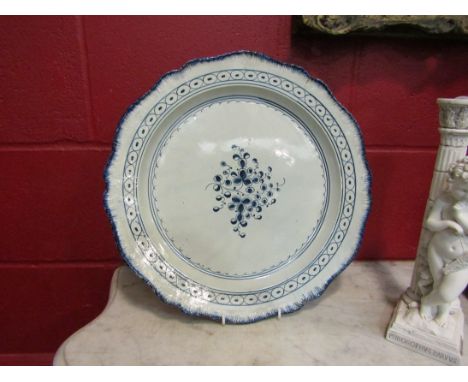 Two 18th Century blue and white chargers in the Worcester style, hairlines to both, 39cm diameter