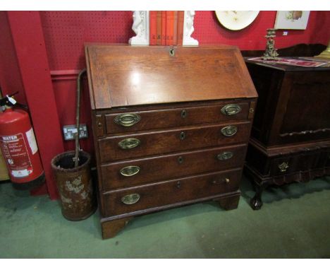 A Georgian oak bureau with fall flap and fitted interior over four graduating long drawers on bracket feet, 105cm x 91cm x 49