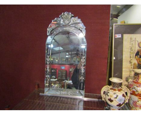 A modern Venetian style mirror with floral spray decoration, 63cm x 31cm