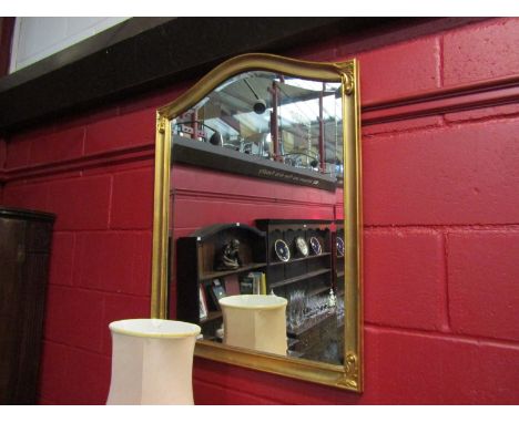 A modern gilt domed top overmantel mirror with bevelled glass, 89cm x 70cm