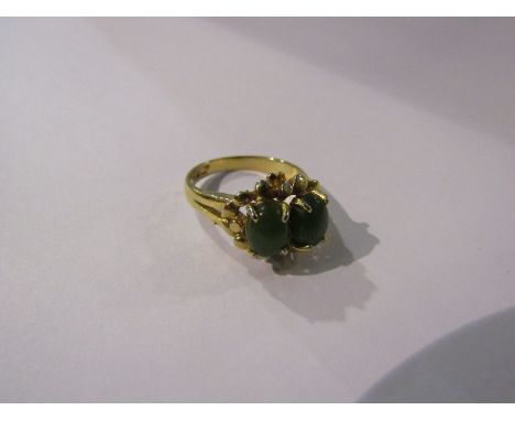 A jade two stone ring with yellow metal shank. Size O, 4.1g 