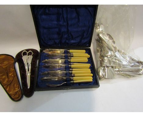 A quantity of silver plated and steel cutlery including grape scissors and sauce ladle