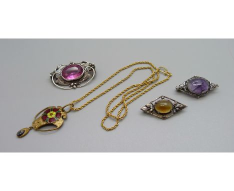 Three Arts and Crafts brooches and an enamel pendant 