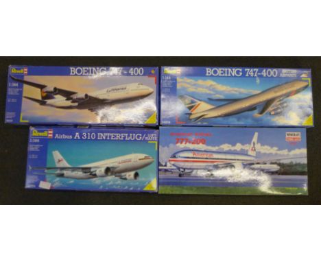 Four 1:144 scale model passenger aircraft, three by Revell and one Minicraft 