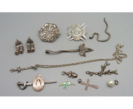 A silver brooch marked Westmorland &amp; Cumberland, lacking pin, two Victorian silver brooches, a silver leaf item by Charle