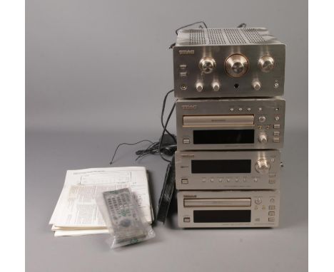 A Teac H300 four tier stacking Hi-Fi system including radio, cd player, cassette player and amplifier.  