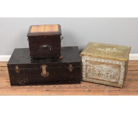 A tin trunk along with two ash boxes including decorative brass example.  