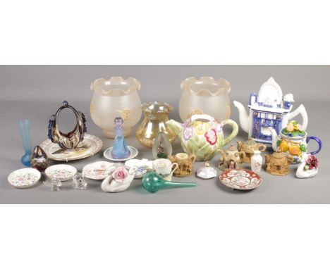 A box of miscellaneous. Includes art glass, Mdina paperweight, oil lamp shades, novelty teapots etc.  
