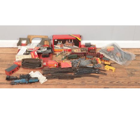 A collection of mainly Hornby and Tri-ang model railway. To include engines, carriages, models and track.  Barn find; in need