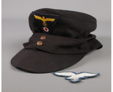 A German Third Reich M43 style cap along with embroidered patch.  