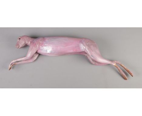 A fibreglass model formed as a skinned hare without ears.  