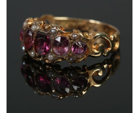 A Victorian Almandine garnet and pearl ring, tests as high carat gold. Size K, 2g.  