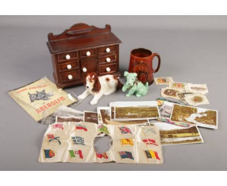 A quantity of collectables. Includes Sylvac, apprentice sideboard, Scottish postcards, silks and a British Railways Aberdeen 