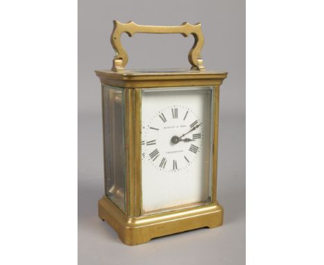 A small Nineteenth century brass carriage clock, with French movement. Roman Numeral dial stamped for Bishop &amp; Son, Trowb