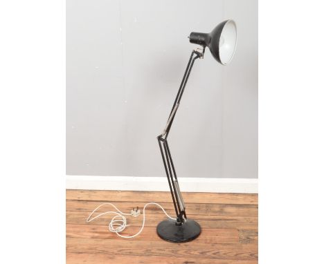 A large black angle poise lamp.  