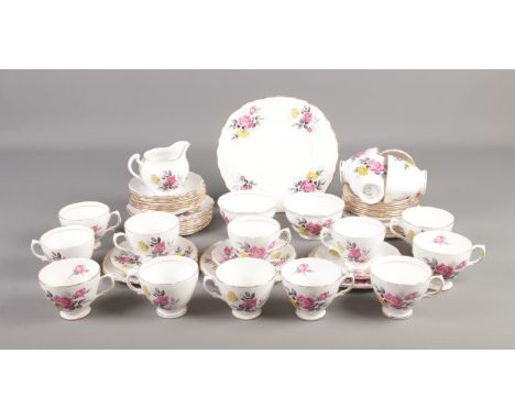 A Royal Vale tea service decorated with a floral pattern to include cake plate, jug and sugar bowls.  