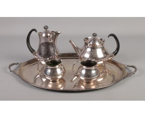 A four piece Eric Clements for Mappin &amp; Webb silver plated tea service with tray.  